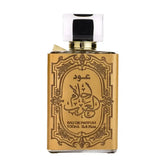 Goudkleurige rechthoekige Ard al Zaafaran oud Ahlam Arab parfumsfles met arabische sierlijke letters en glazen dop