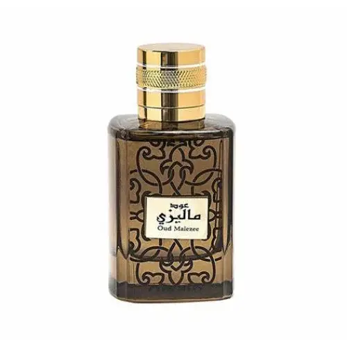 Een rechthoekige amberkleurige glazen fles met zwart geëtste patronen en gouden dop van ard al zaafaran oud malezee