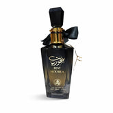 Zwarte glazen parfumfles met gouden accenten en zwarte strik bint hoorea eau de parfum al fakhr