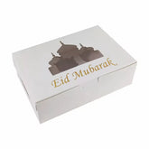 Witte cadeauverpakking met Eid Mubarak tekst en moskeer silhouet voor cupcakes Eid