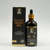 Ethopische black seed olie koud geperst in een donker amber glasfles met goudkleurige druppelaar en zwarte verpakking
