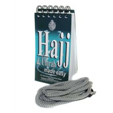 Spiraalgebonden Hajj en Umrah gidsboek met teal en wit cover en zilveren bladwijzer