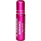 Een levendige roze metallic rollerball parfumfles met bijpassende dop van al haramain parfumolie romance pure 10 ml