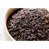 Harmal Zaadjes 100 Gram met een kom zwarte komijnzaadjes voor gezonde kruidenmix