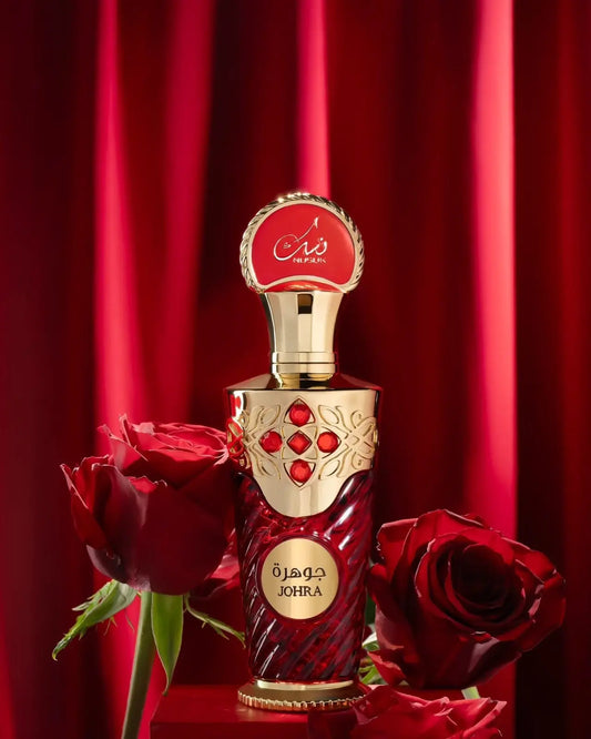 Een luxueuze rode en gouden johra edp 100 ml parfumfles met complexe reliëfpatronen en robijnrode steentjes