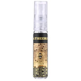 Een heldere sprayfles lattafa atheri met een zwart-gouden honingraatdesign en bijillustratie op het label
