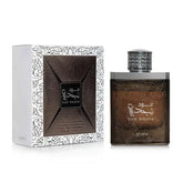 Donkere bruine textuurlijke glazen fles met zilveren dop en arabische gravure oud nadjia van lattafa parfum