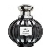 Zwart geribbeld glazen parfumflesje met zilveren dop en label arabisch oud al qamar van Lattafa Parfum