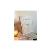 Lichtgekleurde deen planner wit met decoratieve rand voor planning en inspiratie