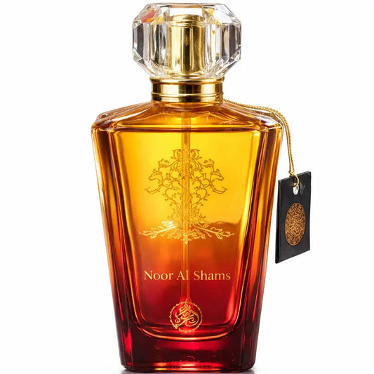 Een luxueuze amberrode glazen parfumfles noor al shams met een facetten kristalstop en gouden arabische kalligrafie