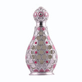 Zilverkleurige parfumfles van parfumolie layla met decoratief rond patroon en roze en rode accenten