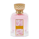 Pink parfumfles met gouden textuurkap en decoratief label voor Riffs Parfum Blossom Rose