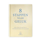 Een zacht crèmekleurig hardcover boek met elegante blauwe schreefletter en subtiel geometrisch ontwerp genaamd 8 stappen naar geluk