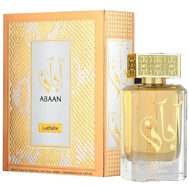 Een gouden facetten parfumfles van glas met een sierlijke gouden dop en arabische letters, product abaan