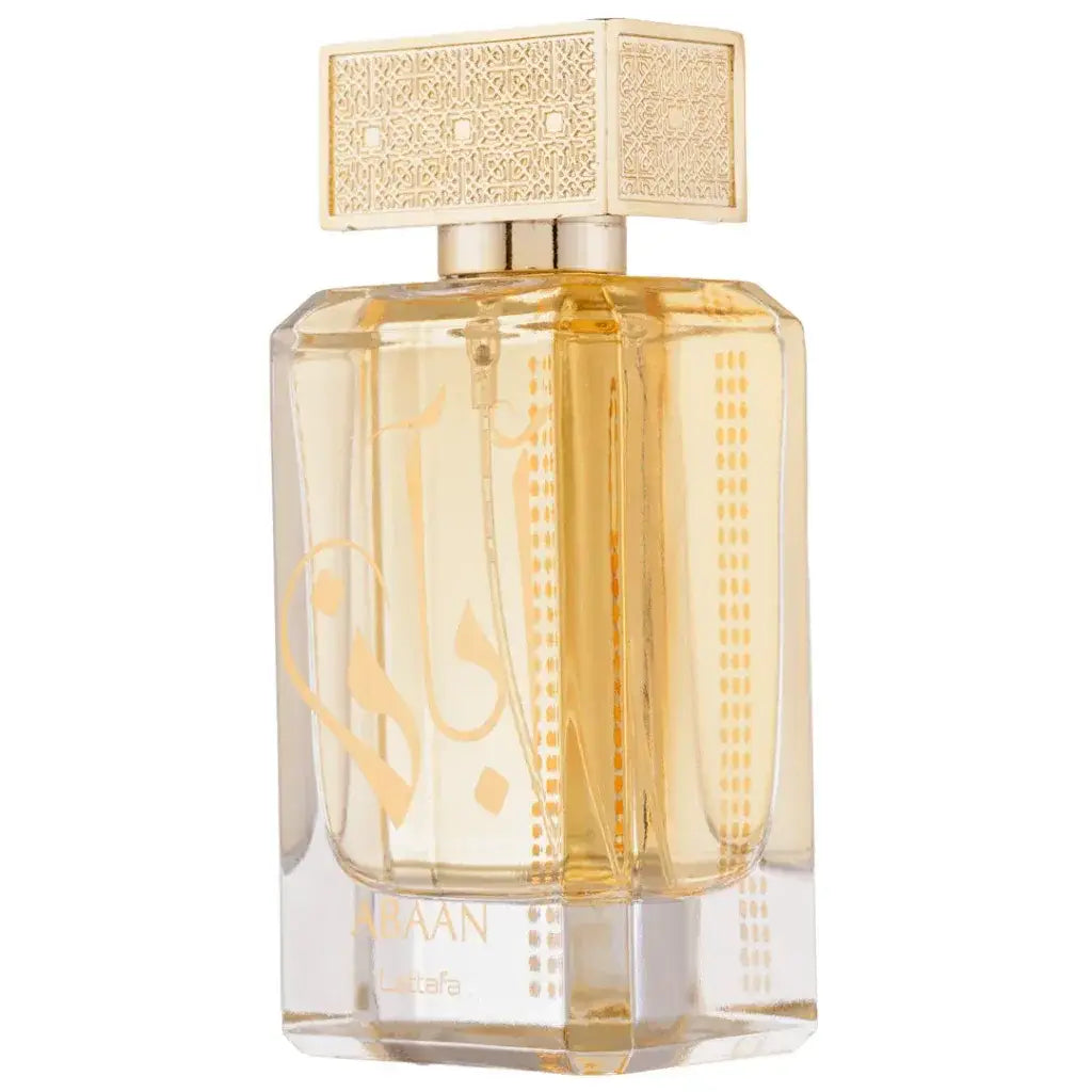 Een gouden facetten glazen parfumfles abaan met een sierlijke gouden dop en arabische gravure