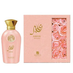 Roze parfumbottle en cadeauverpakking met rozenaccenten voor Abeer parfum