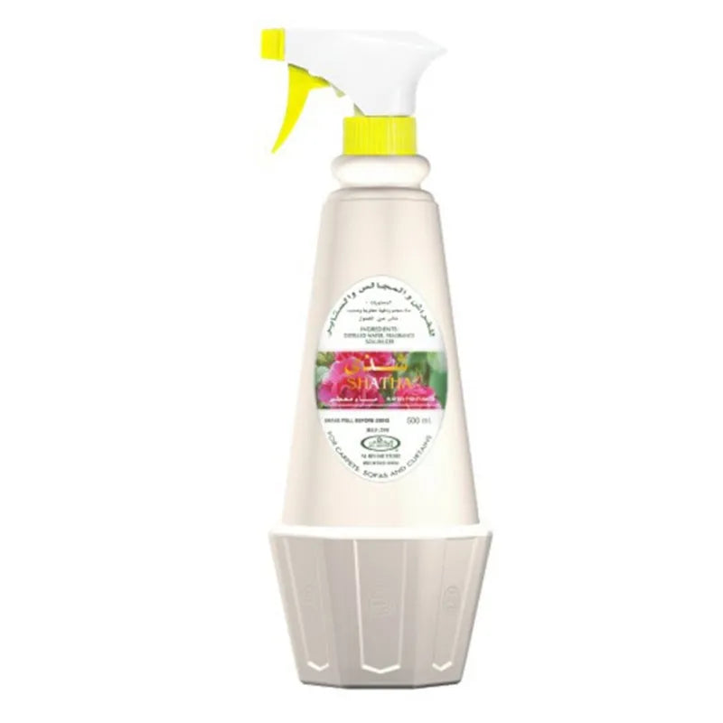 Witte sprayfles met bloemenlabel en gele sprayer van Al-Rehab Roomspray Shadha