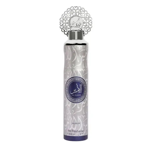Silver and white ornate al ameer luchtverfrisser spray with decorative metal cap and arabic script label