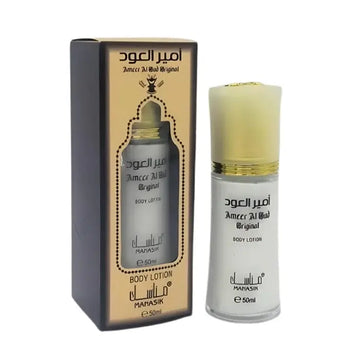 Witte glazen fles met gouden dop en arabische tekst ameér al bood originele bodylotion van Manasik