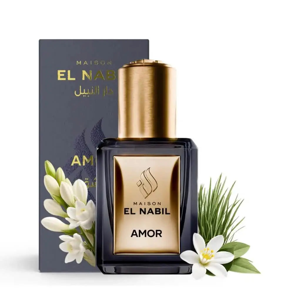 Elegante donkerglas fles maison el nabil amor parfumolie met gouden dop en label versierd met witte bloemen