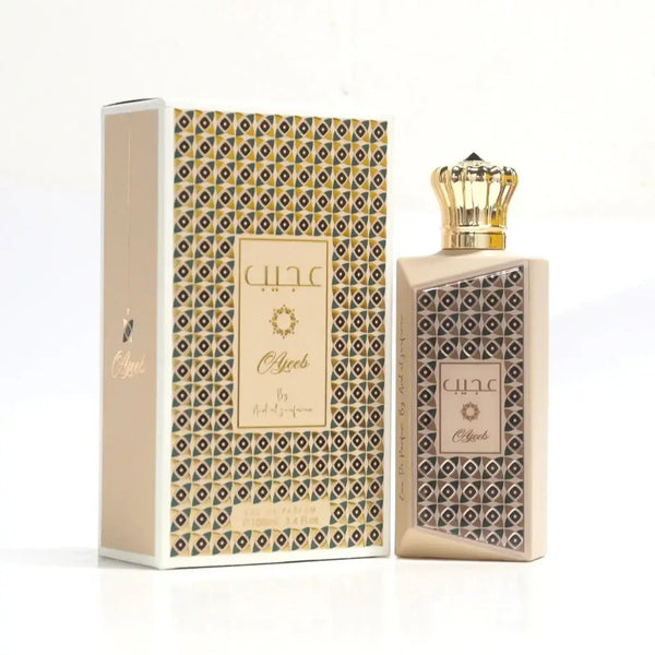 Beige luxueuze parfumfles met gouden kroonvormige dop en geometrisch patroon naast bijpassende ard al zaafaran ajeeb doos