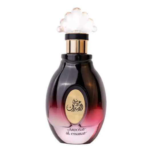 Een luxueuze zwarte en roze gradient glazen parfumfles met gouden dop en arabische tekst van ard al zaafaran aroosat al emarat
