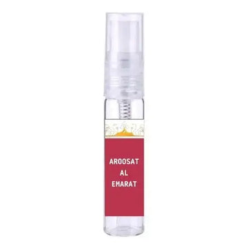 Een helder glazen sprayfles van ard al zaafaran aroosat al emarat met rood etiket en witte tekst