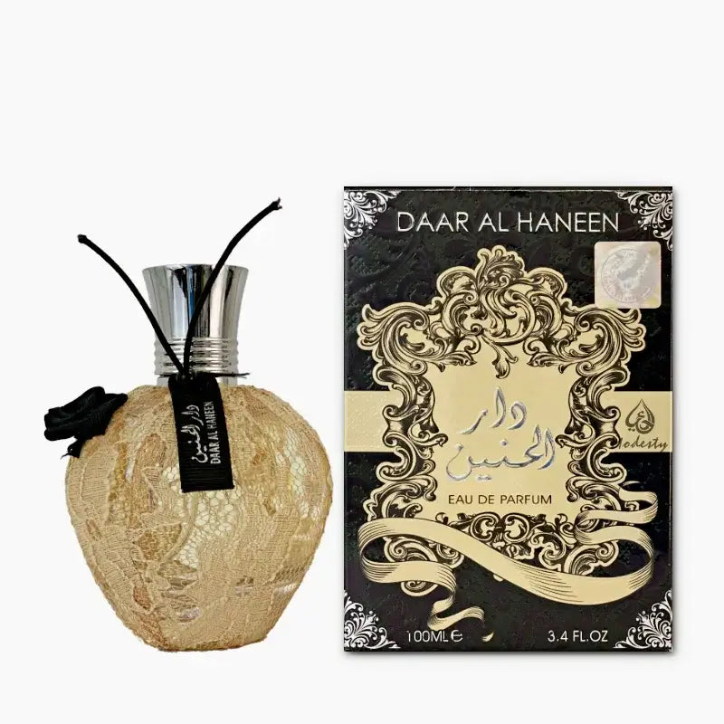 Aroma parfumfles ard al zaafaran dar al haneen met gouden kant, zilveren dop en zwart lint detail