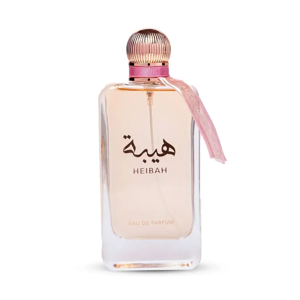 Ard al zaafaran heibah eau de parfum in een strakke transparante glazen fles met een roségouden geribbelde dop en een roze lint