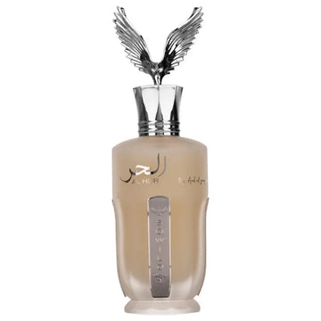 Een beige glazen Ard al Zaafaran al Hur So Wild parfumfles met zilveren adelaarvormige dop en metalen verticale branding