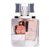 Een strak transparant glazen parfumflesje met moderne geometrische vorm en zilveren accenten van ards al zaafaran lovers message