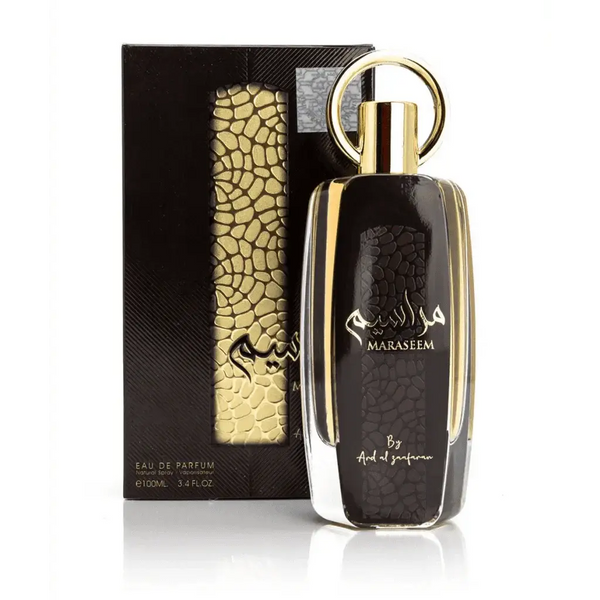Zwarte glazen parfumfles met gouden accenten en ringvormige dop met merknaam maraseem in Arabisch script van Ard al Zaafaran Maraseem