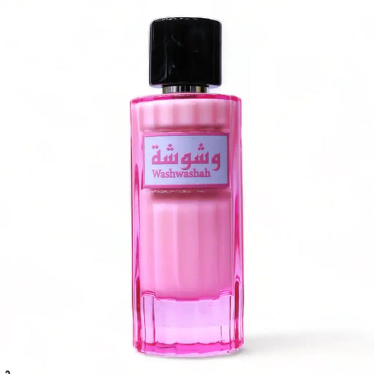 Een levendige roze facetten glazen parfumfles met zwarte dop en label washwashah in arabisch en engels voor ard al zaafaran milky wash washa