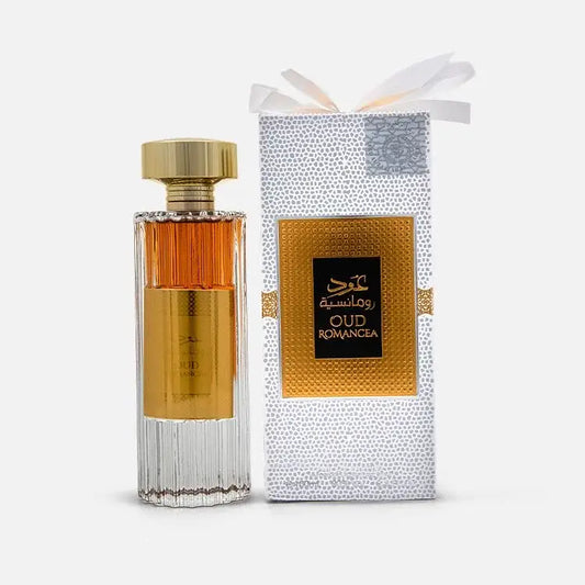 Elegante amberkleurige Ard al Zaafaran oud romancea parfumfles met gefacetteerd glas en goudkleurige dop naast zilverkleurige doos