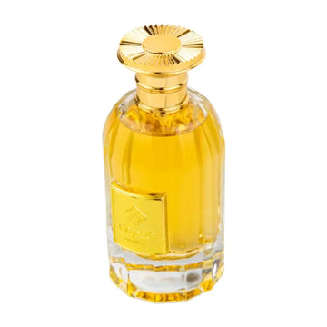 Golden-hued ard al zaafaran qidwah perfume bottle with faceted crystal body and ornate sunburst gold cap