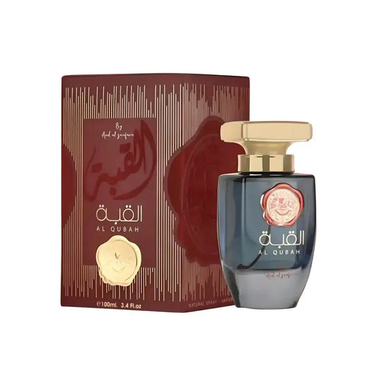 Donkere blauwe glazen parfumfles met gouden dop en roze zegel van al qubah van ard al zaafaran al qubah