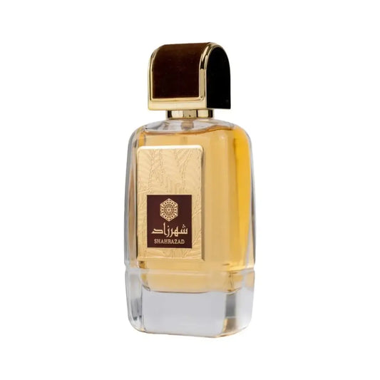Een slanke rechthoekige glazen fles ard al zaafaran shahrazad parfum met gouden dop en donkerbruine accenten
