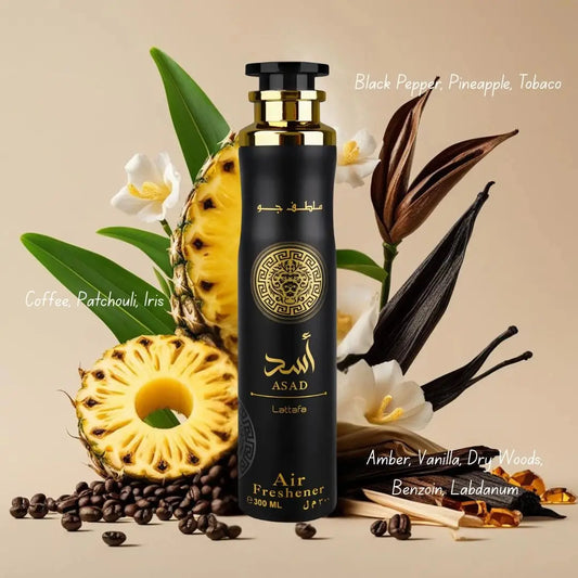 Zwart asad luchtverfrisser 300ml fles met gouden accenten en ingewikkeld embleem omringd door tropisch fruit