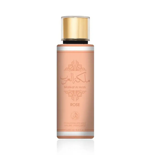 Een elegant perzikkleurig attar malikat al arab body mist flesje met gouden dop en arabische opdruk rose geur
