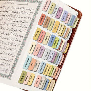Koran index tabs geplakt in een Koran