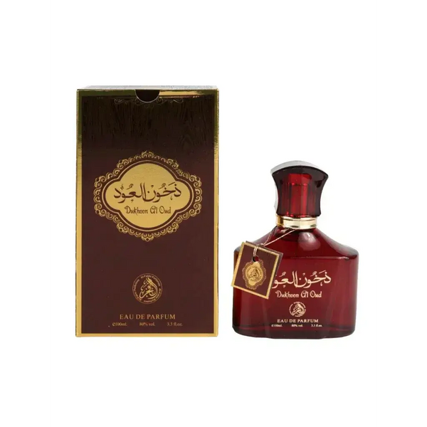 Dieprode glazen fles dukhoom al oud eau de parfum met gouden accenten en arabische kalligrafie op het etiket