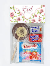 Een feestelijke eid mubarak traktatiezakjes vintage rose ongevuld met chocolade lollie eid mubarak en snoepreepjes