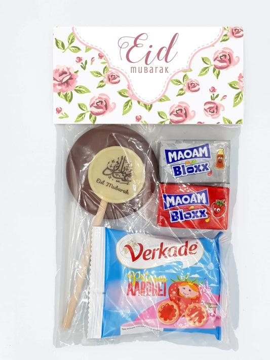 Een feestelijke eid mubarak traktatiezakjes vintage rose ongevuld met chocolade lollie eid mubarak en snoepreepjes