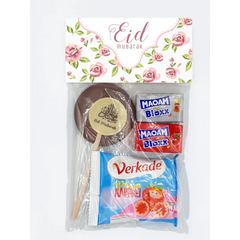 Een feestelijke eid mubarak traktatiezakjes vintage rose ongevuld met chocolade lollie eid mubarak en snoepreepjes