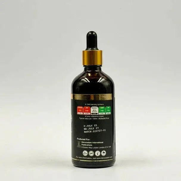 Donkere amberkleurige glazen druppelfles met goudkleurige dop en zwart label van ethiopische black seed olie koud geperst 100ml