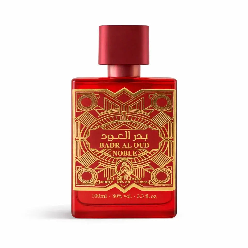 Rode rechthoekige glazen parfumfles al fakhr badr al oud noble met goud reliëf en arabische en Engelse tekst