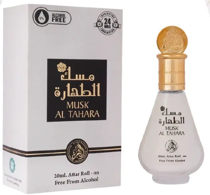 Een stijlvolle witte glazen fles met gouden dop en arabische reliëftekst musk al tahara parfumolie 20 ml naast doos
