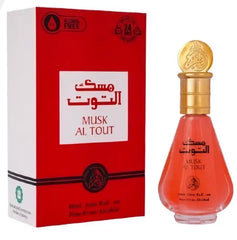 De fles is een koraalrode musk al tout parfumolie van 20 ml met een gouden dop en gedetailleerd ontwerp in een rode doos