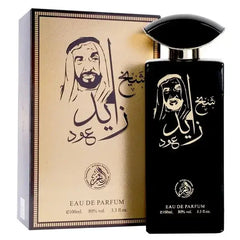 Zwarte rechthoekige sheikh zayed oud parfumfles met gebogen dop en gouden arabische letters