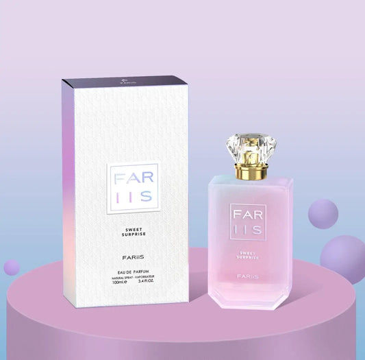 Roze rechthoekige Fariis sweet surprise eau de parfum fles met gouden dop en kristalachtig topje